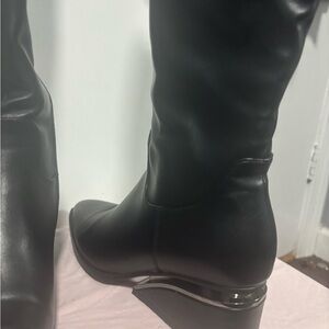 Sleek Black Leather Heeled Boots